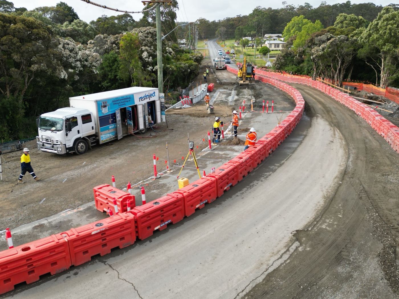 Resinject ground stabilisation works on a road with traffic barriers